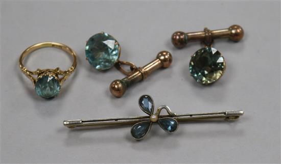 A 15ct gold and blue zircon ring, an early 20th century 15ct gold and gem set bar brooch and a pair of gem set cufflinks.